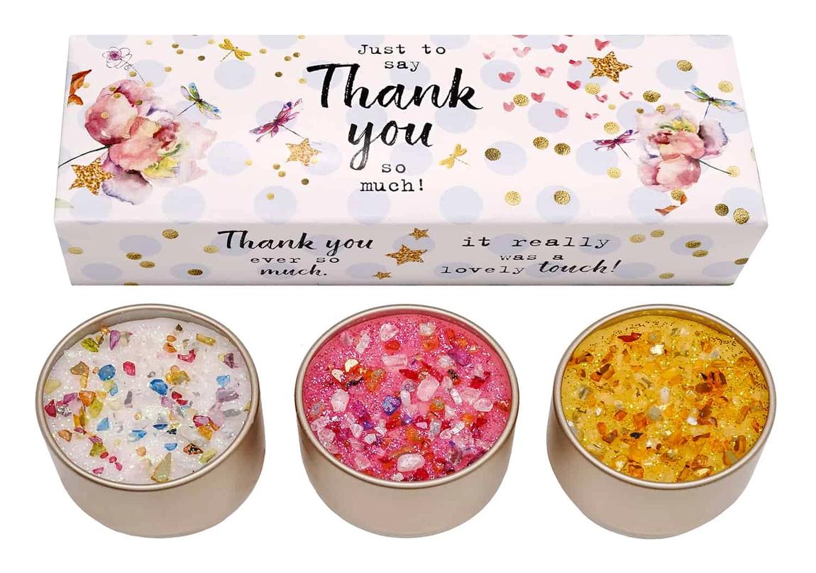 Three different colored candles in a gift box with 'Thank You' text and decorative elements.