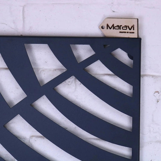 Decorative metal panel with geometric cut-out design on a white background, featuring the brand 'Maravi'.