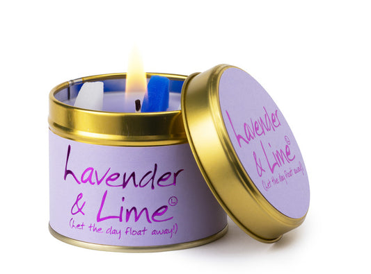 Lavender & Lime candle in a tin with a lit candle inside on a white background