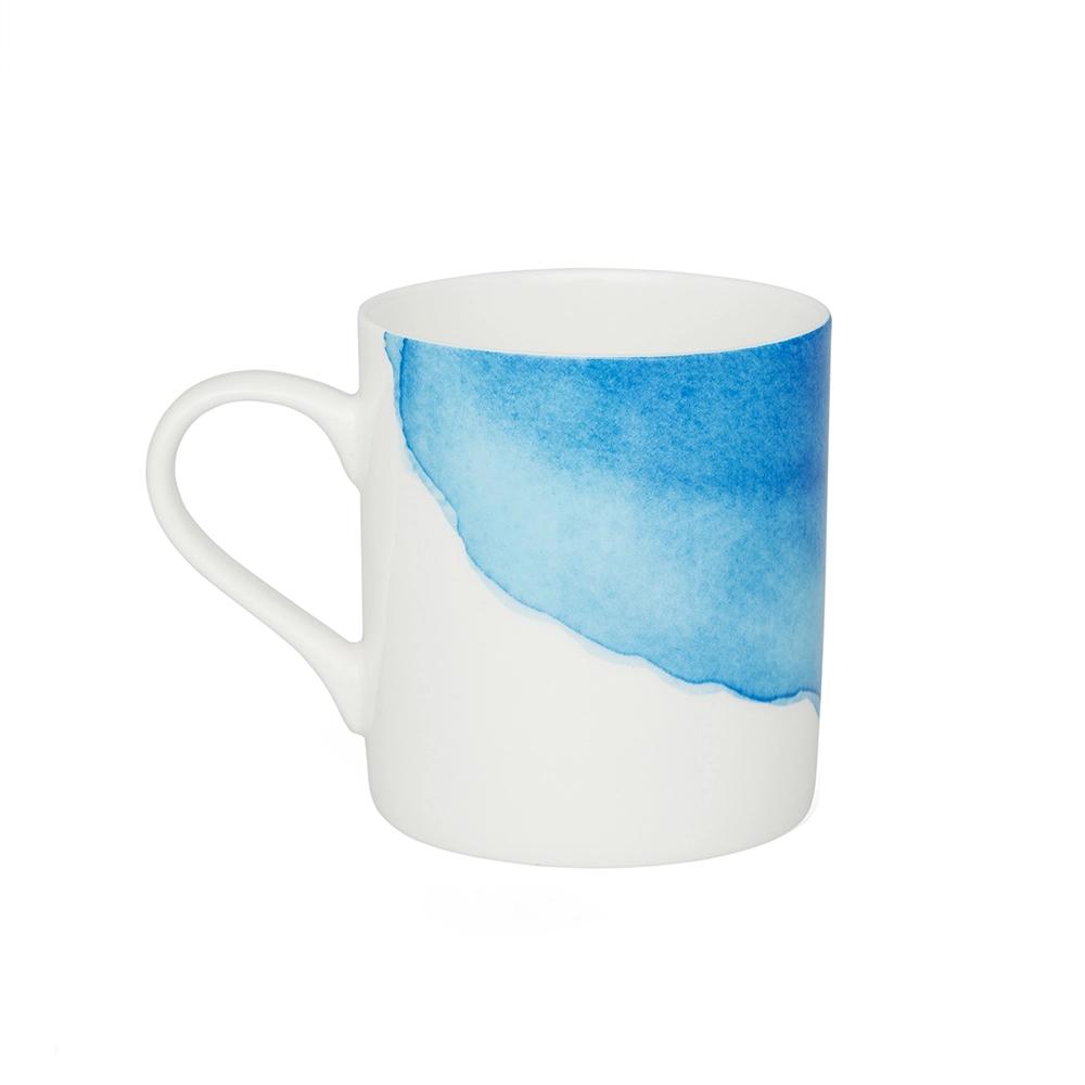 White mug with a blue watercolor design on a white background