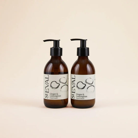 Two brown bottles with pump dispensers on a beige background