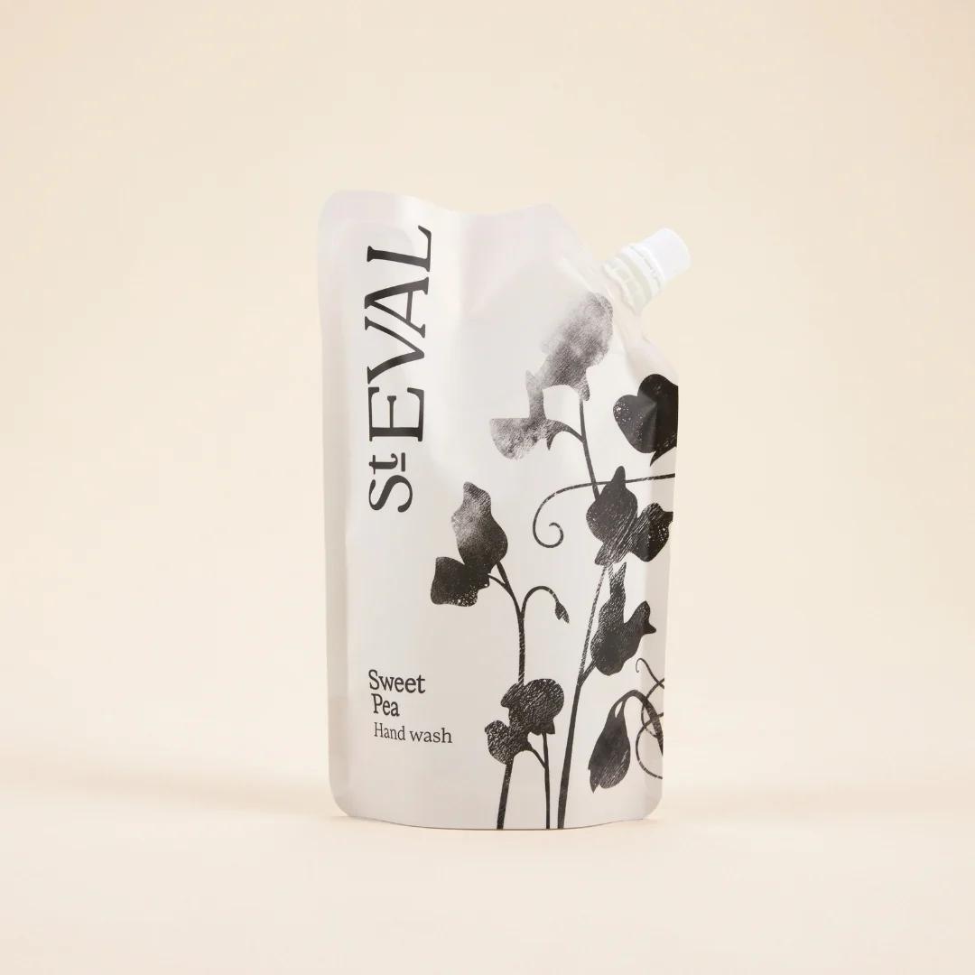 White bottle of St. Eval Sweet Pea hand wash on a beige background