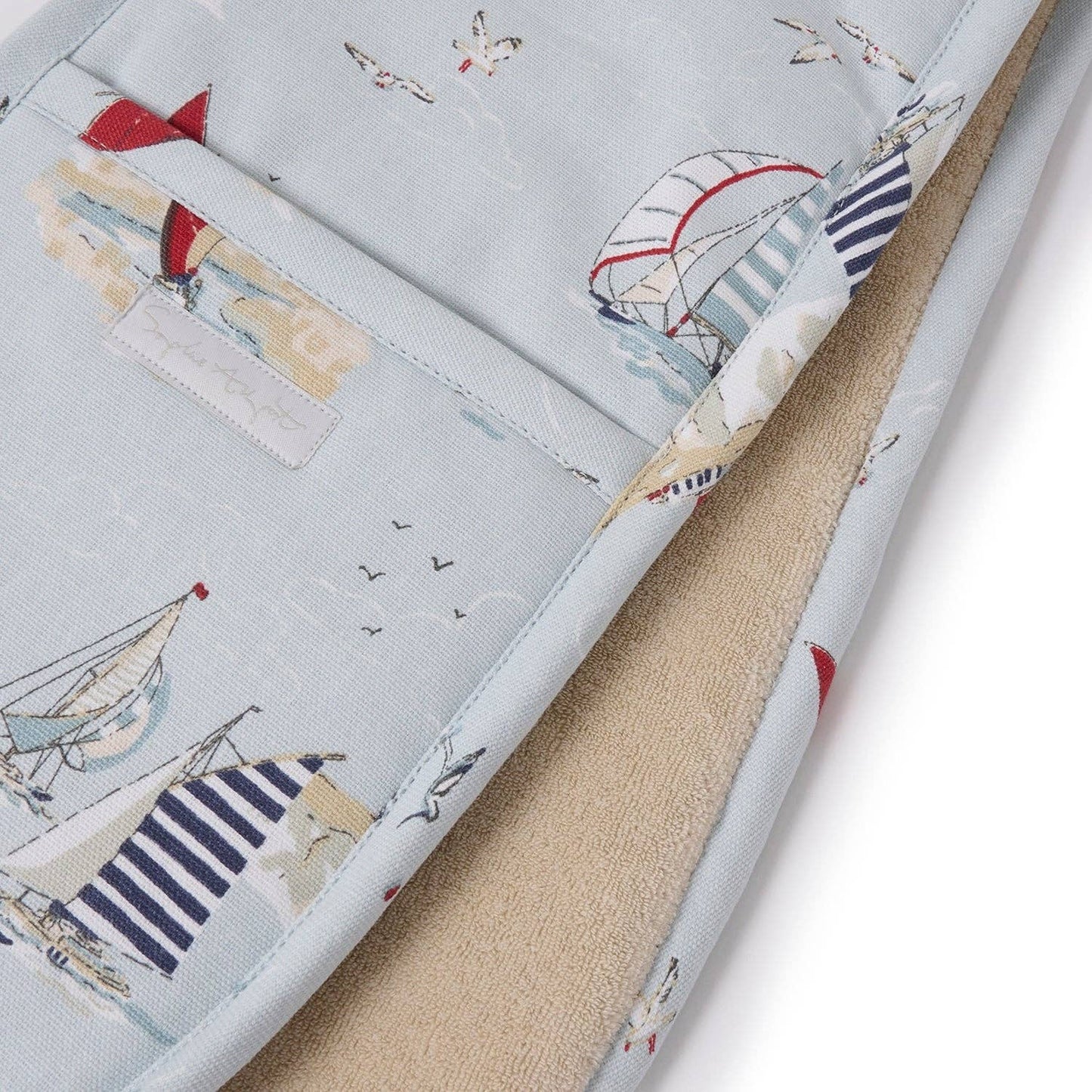 Fabric with sailboat pattern on a light blue background
