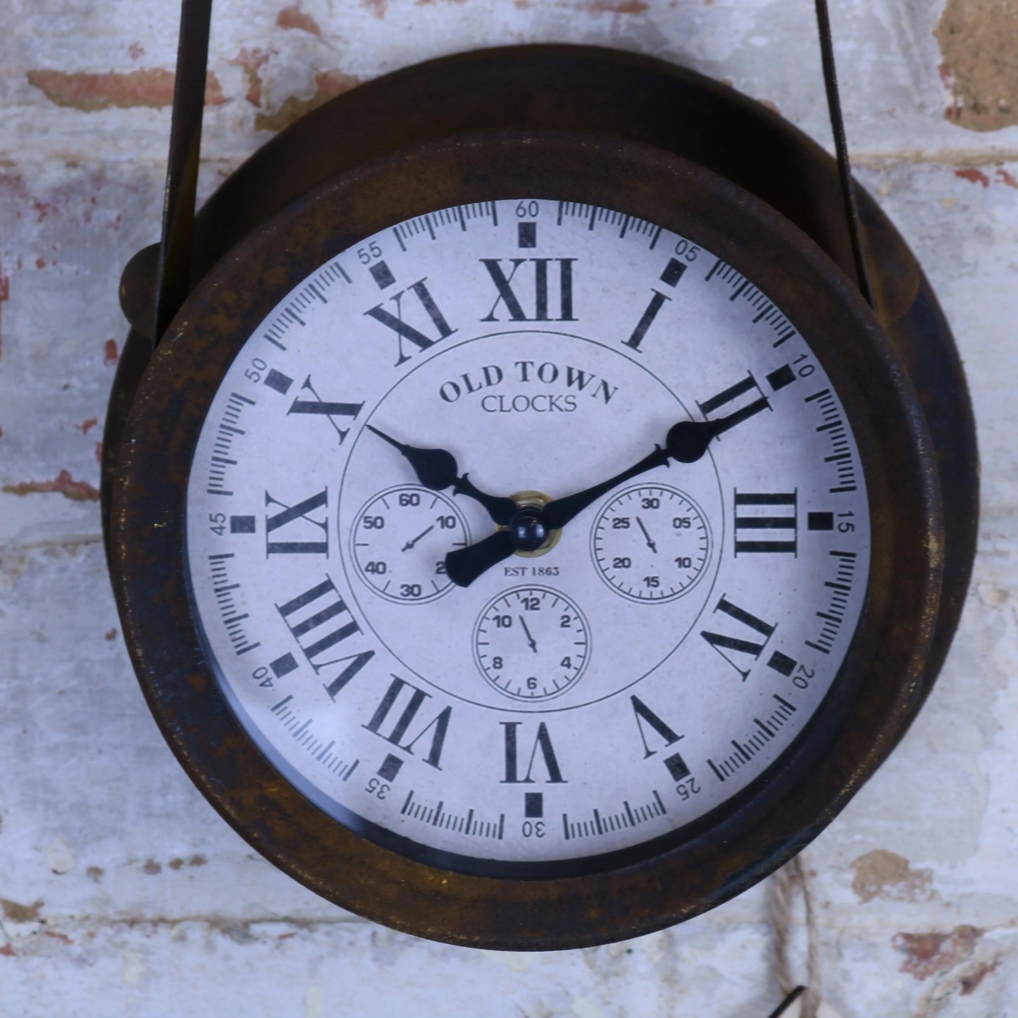 Vintage-style clock with Roman numerals on a textured wall background