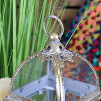 Decorative metal lantern with a colorful blurred background