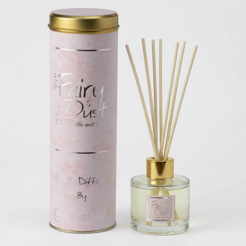 Fairy Dust reed diffuser set by Candle Flame, featuring a tall light pink marble-patterned cylindrical packaging container with a gold lid next to a clear glass bottle with a gold cap, beige reeds, and a matching pink label.