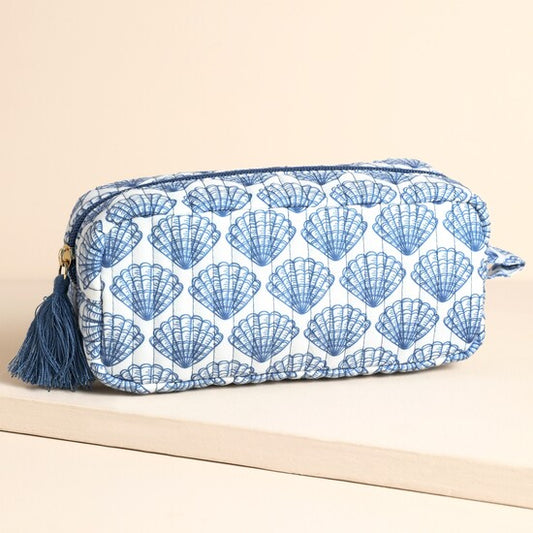 Cosmetic bag with blue shell pattern on a beige background