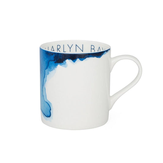 White mug with blue abstract design and 'Harlyn Bay' branding on a white background