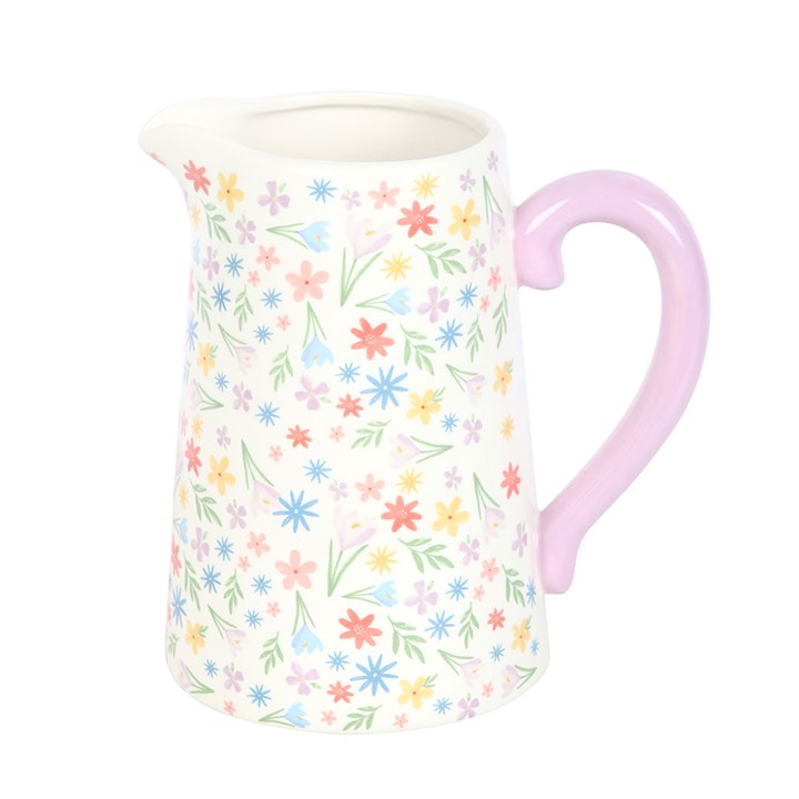 Mug with floral pattern and pink handle on a white background