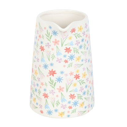 Decorative vase with pastel floral pattern on a white background