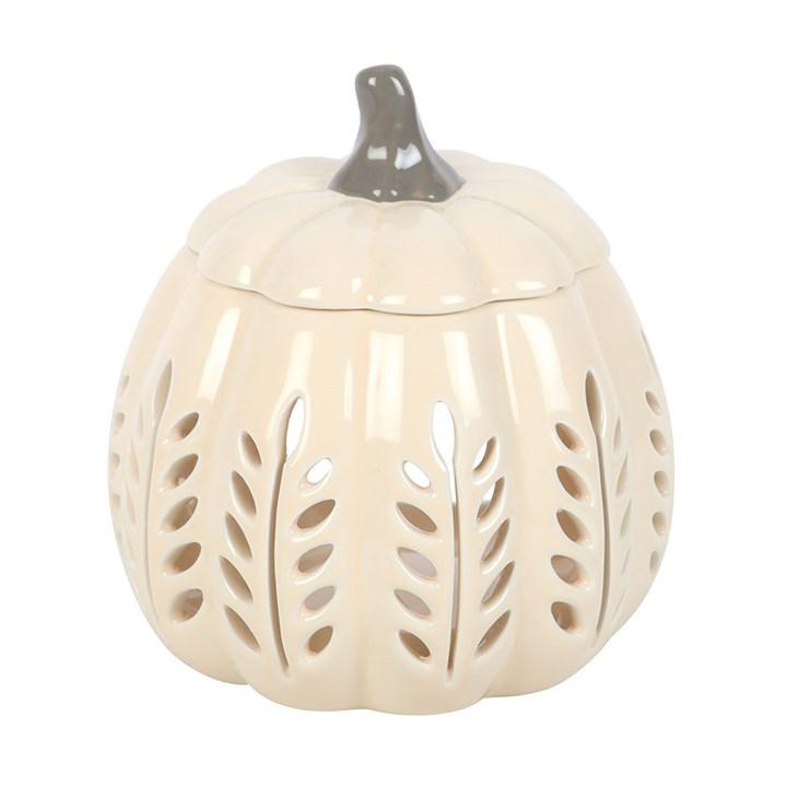 Ceramic pumpkin with cut-out leaf patterns on a white background