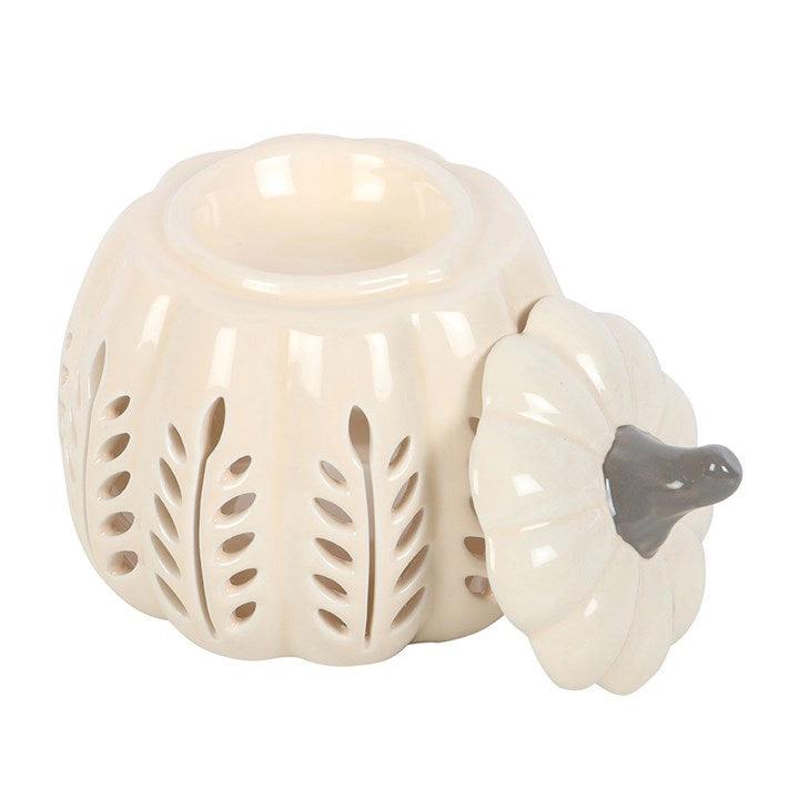 White ceramic pumpkin-shaped oil burner with a lid on a white background