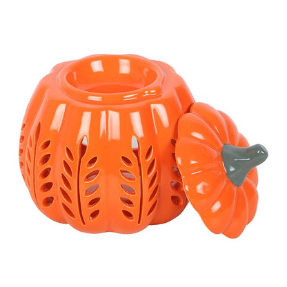 Orange ceramic pumpkin-shaped lantern with a black stem on a white background