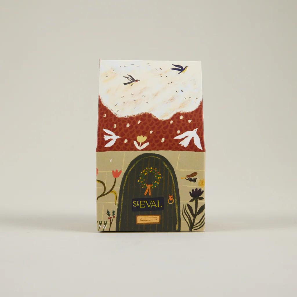 Notebook with floral design and 'ST EVAL' branding on a beige background