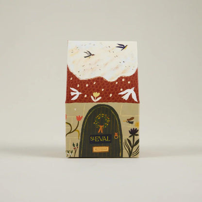 Notebook with floral design and 'ST EVAL' branding on a beige background