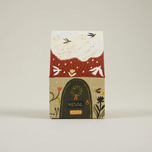 Notebook with floral design and 'ST EVAL' branding on a beige background