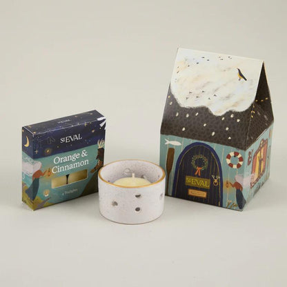 ST EVAL candle and packaging on a light gray background