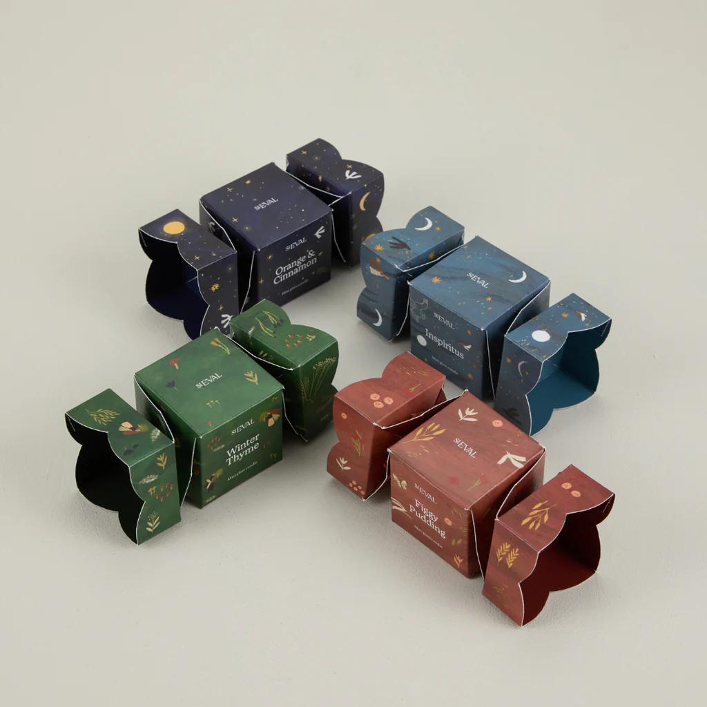 Set of decorative boxes with various designs on a light gray background