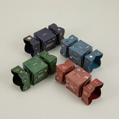 Set of decorative boxes with various designs on a light gray background