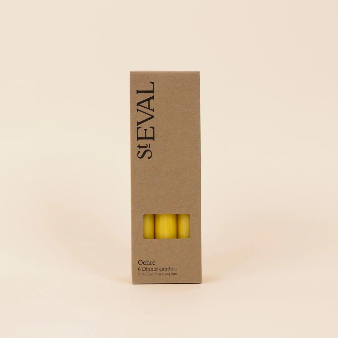 Box of St. Eval Ochre candles on a beige background