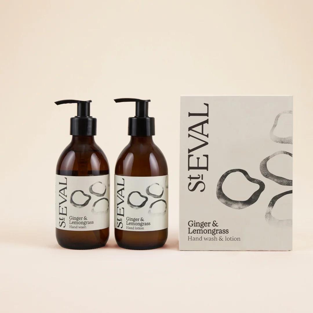 Two St. Eval Ginger & Lemongrass hand wash bottles and a box on a beige background