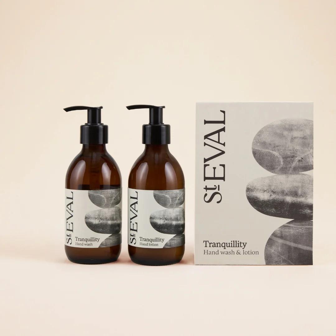 Two bottles of St. Eval Tranquillity hand wash with a box on a beige background