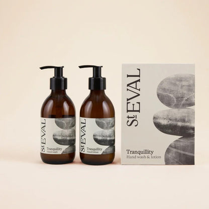 Two bottles of St. Eval Tranquillity hand wash with a box on a beige background