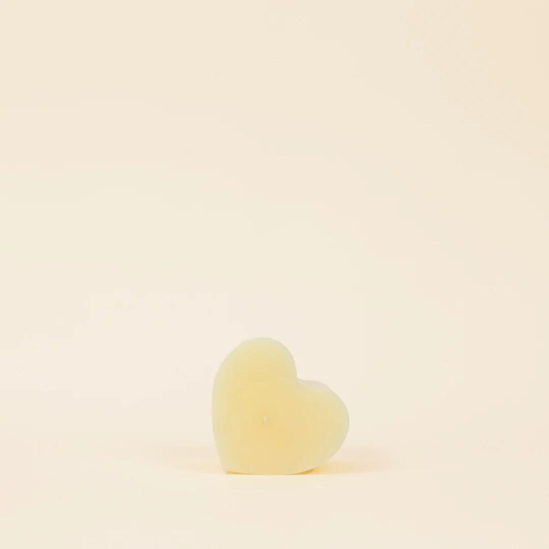 Heart-shaped object on a beige background