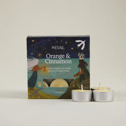 ST Eval Orange & Cinnamon candles with packaging on a light background