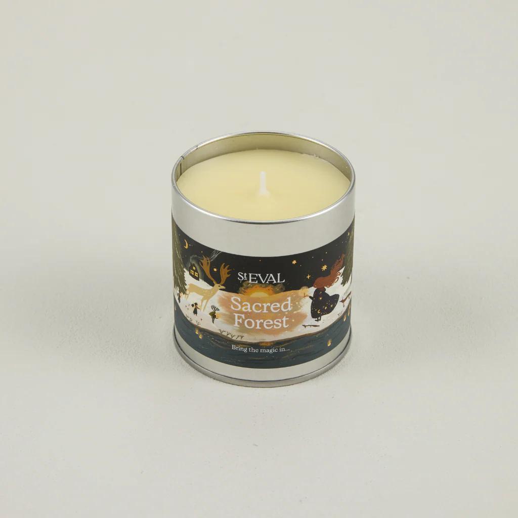Candle in a metal tin labelled 'Sacred Forest' by ST Eval on a light grey background
