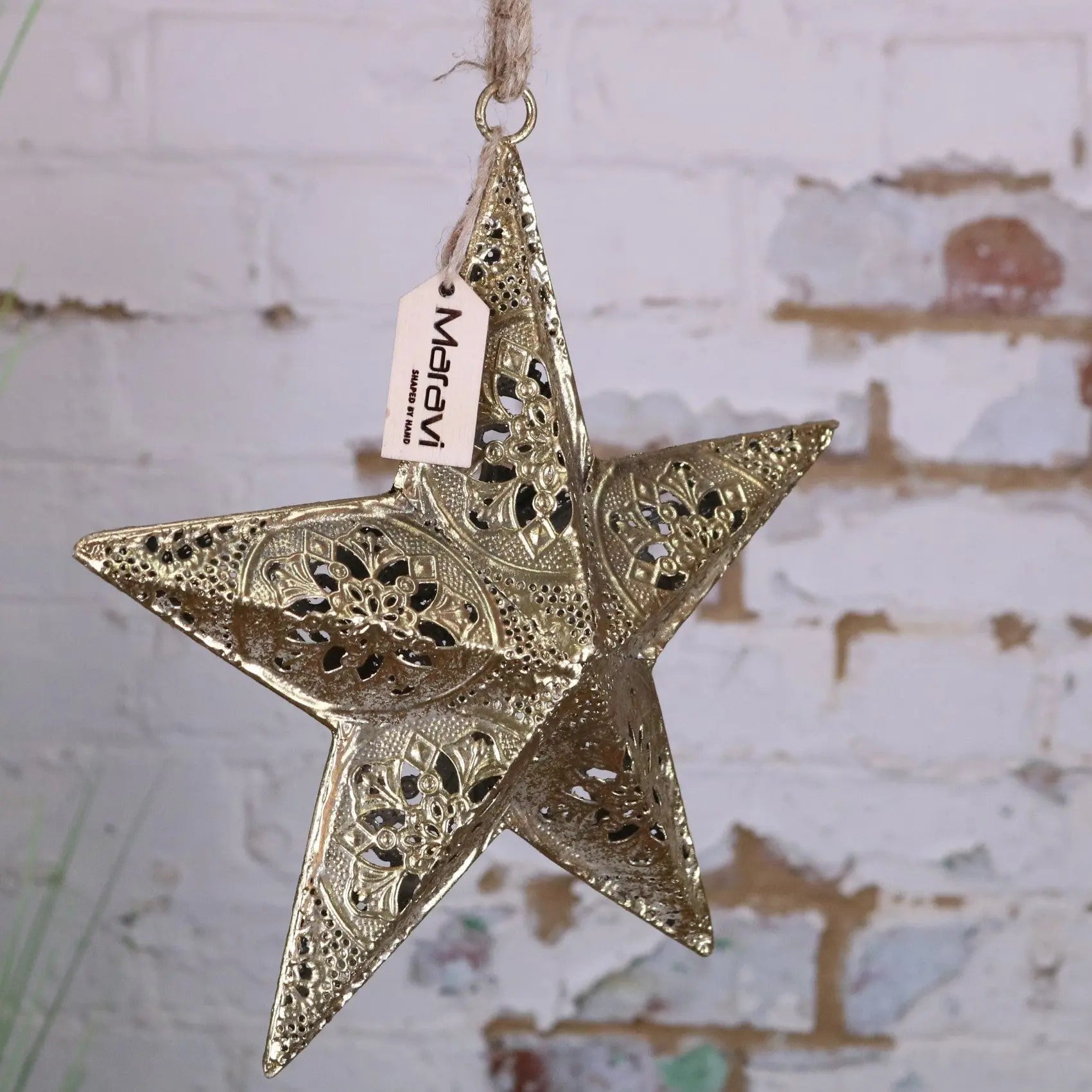 Decorative star ornament with intricate patterns and a 'Matavi' tag on a textured background