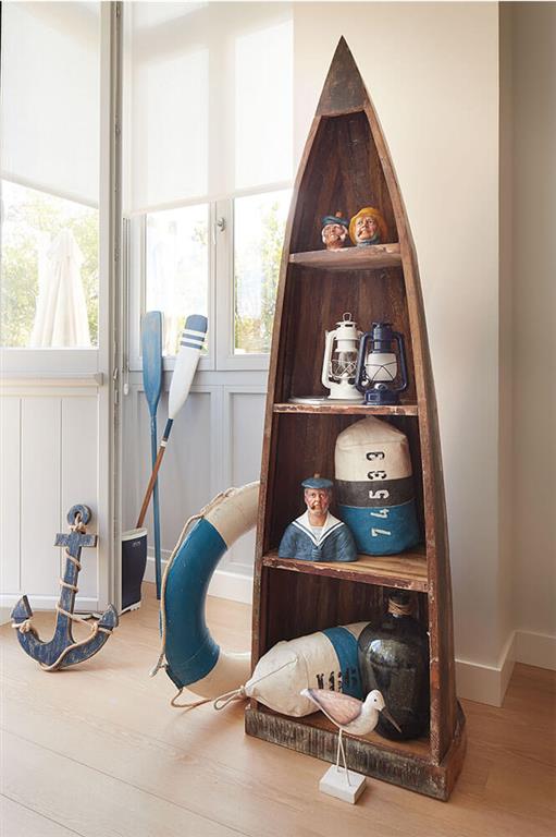 Blue metal LED hurricane lantern lamp on wooden shelves